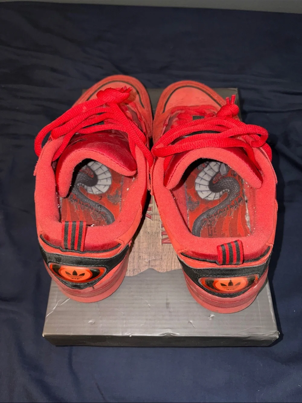 adidas Red Low-Top Sneakers with Black Stripes